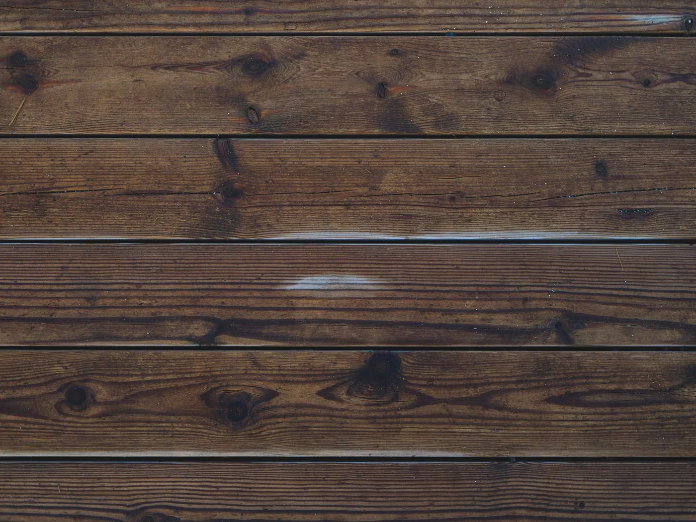 detailní textura hnědých dřevěných prken