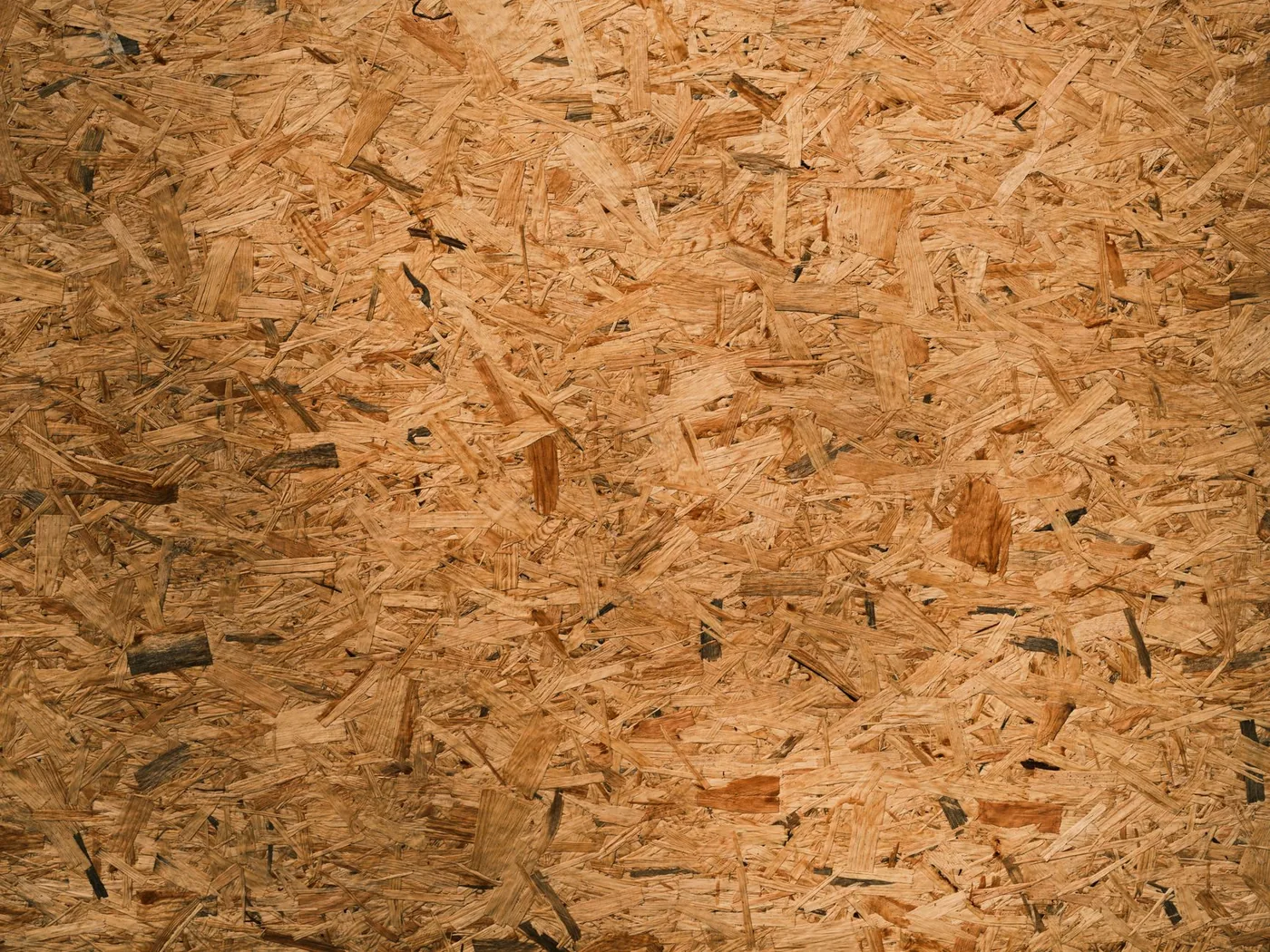 Detailní textura OSB desky se štěpkami dřeva